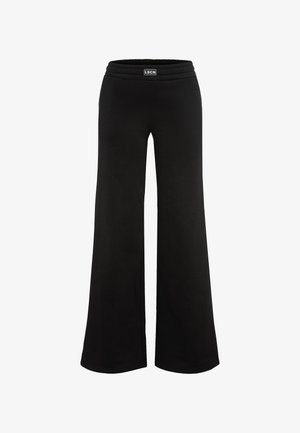 Mustad mustad püksid pehmest materjalist, millel on elastne vöökoht. Disainil on esiküljel logo plaastr.