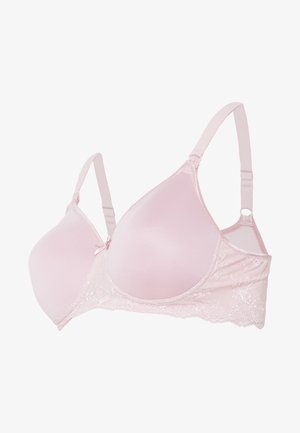 Pink lace bra with molded cups, adjustable straps, and a decorative bow at the center. Features soft fabric and detailed lace trim.