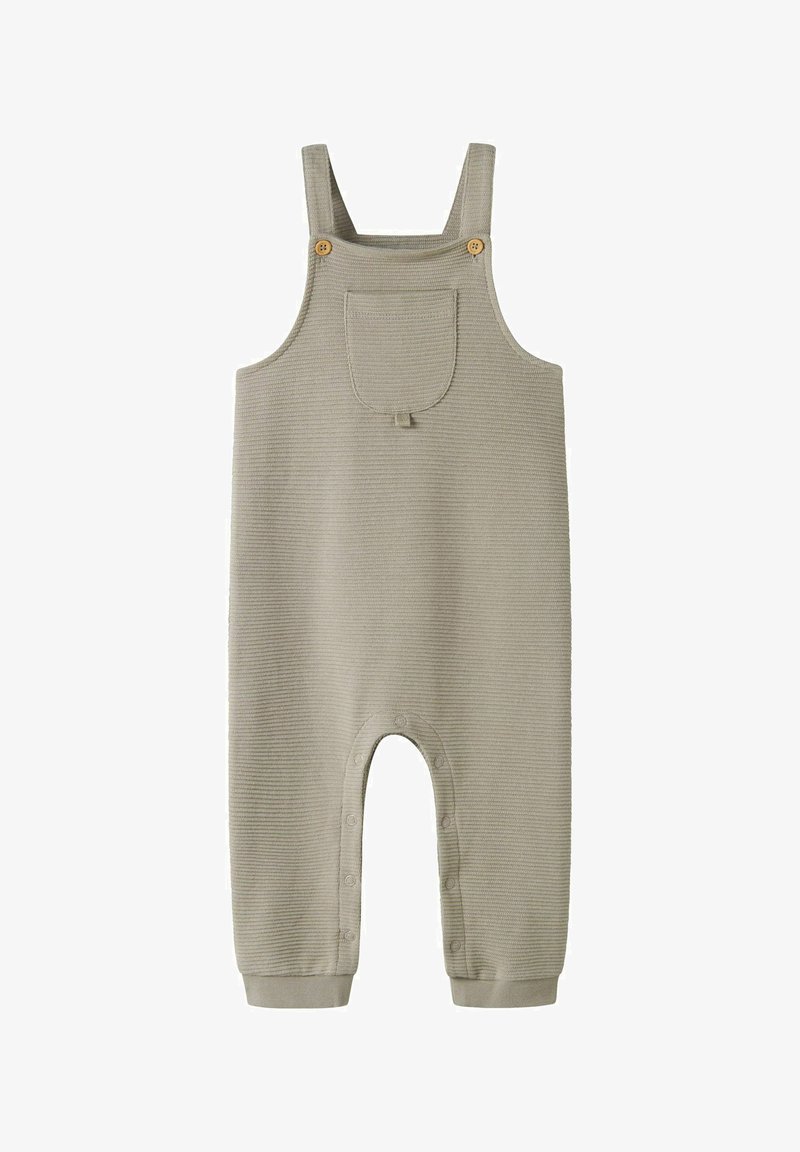 Beige geribbelde babyoverall met voorzak, houten knoopbandjes en drukknoopsluitingen langs de binnenkant van de benen voor gemakkelijke luierwissels.