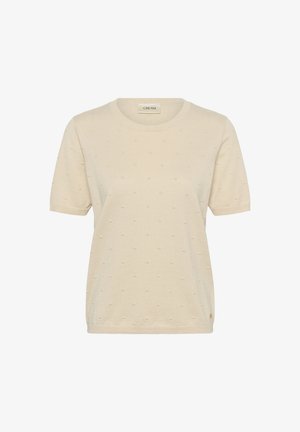 Cream-colored short-sleeve knit top with subtle raised dot pattern, crew neckline, and ribbed cuffs.