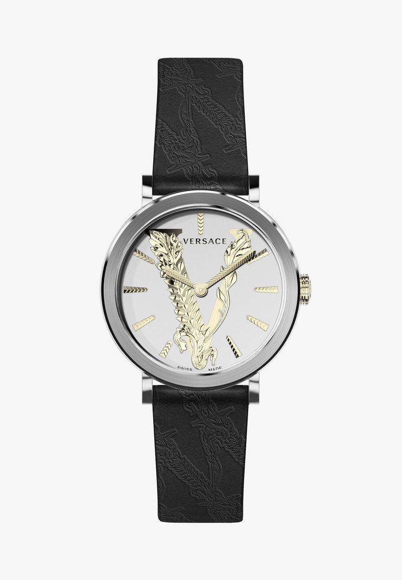 Versace watch with a silver face, gold V logo, and black textured leather strap. Features simple hour markers and one crown.