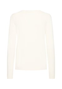 Pull blanc à manches longues avec un col rond, texture côtelée et détails en forme de scallop aux poignets et à l'ourlet. Matériau en tricot léger.