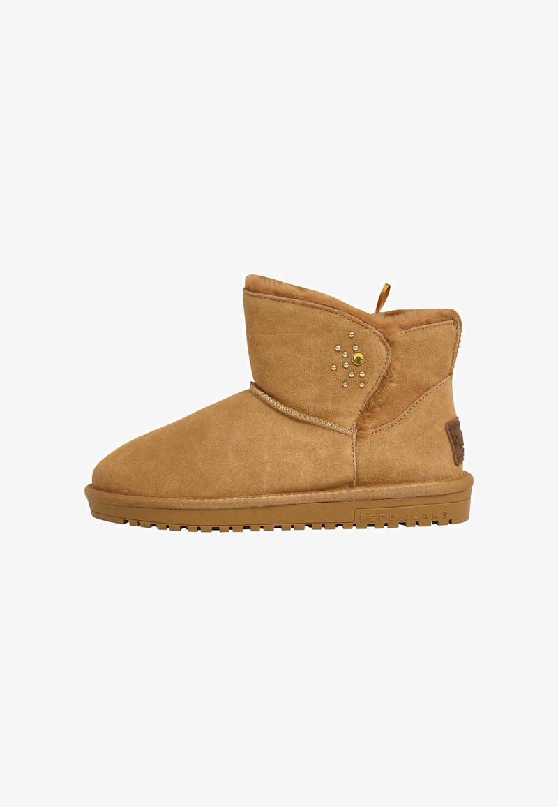 Beige Wildleder-Stiefelette mit weicher Fellinnenausstattung, dekorativen Perlen an der Seite und einer strukturierten Gummisohle. Verfügt über eine Zuglasche für ein einfaches Anziehen.