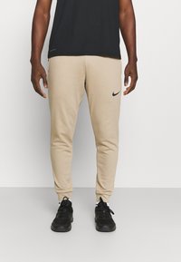 Nike Performance - PANT TAPER - Tracksuit bottoms - khaki/black Thumbnail Image 1