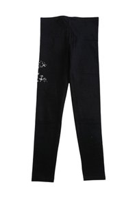 Leggings neri con un piccolo disegno di stella bianca e glitter sul lato sinistro della coscia, esposti piatti su uno sfondo bianco.