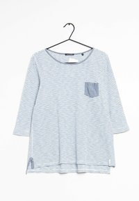 Striped long-sleeve top in blue and white, featuring a chest pocket, rounded neckline, and side slits for a relaxed fit. Made of soft fabric.