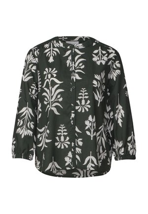 Chemisier boutonné en tissu vert foncé avec un motif floral blanc ; présente des manches longues froncées et un encolure ronde.
