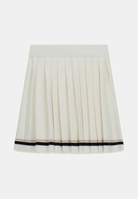 Jupe plissée crème avec une ceinture côtelée et des rayures accent nautiques bleu marine et beige le long de l'ourlet. Fabriquée dans un tissu doux et léger.