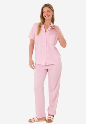 Pink striped short-sleeve pajama set with a button-up shirt and pocket, paired with matching pants featuring a relaxed fit and soft texture.