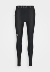 Černé legíny z hladkého, elastického materiálu, se širokým elastickým pasem s logem "Under Armour" a bílým logem na stehně.