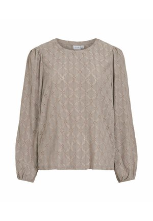 Bēšas krāsas garroku blūze no teksturēta auduma ar dimanta rakstu un izgriezumiem, apaļu kakla izgriezumu un savāktām piedurknēm.