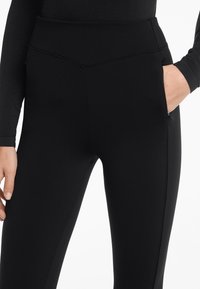 OYSHO HIGH RISE WARM FLARE - Donji dijelovi trenirke - black
