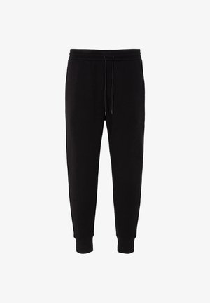 Pantaloni della tuta neri realizzati in tessuto morbido, con vita elastica e cordino, orli a costine e senza motivi o decorazioni visibili.