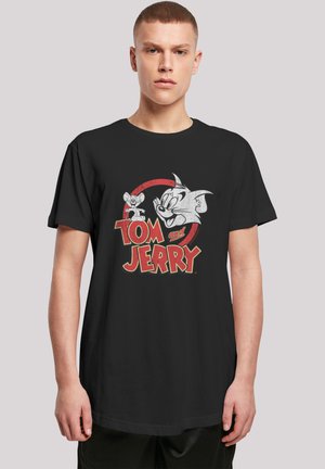Black cotton t-shirt featuring a graphic print of Tom and Jerry, with red accents and a circular design around the characters’ names.