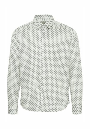 Halenka s dlouhým rukávem na knoflíky s bílým pozadím a modrými kulatými květinovými vzory a špičatým límečkem. Hladká textura látky.