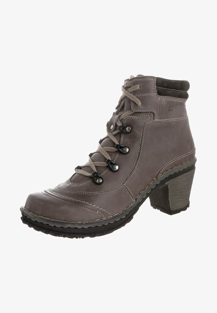 Bottine en cuir gris avec fermeture à lacets, œillets en métal noir, col rembourré et talon épais empilé.