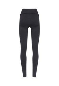 Legging neri con motivo ondulato e testurizzato. Design a vita alta, forma aderente e tessuto liscio adatto per abbigliamento sportivo.
