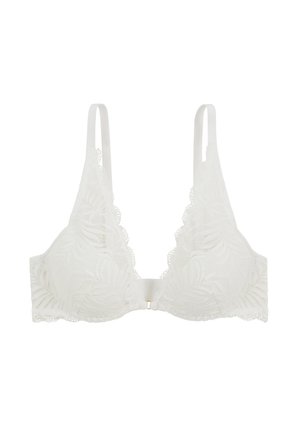 Soutien-gorge en dentelle blanche avec des bonnets triangulaires, motif floral, bords festonnés et bretelles réglables. Fermé par un fermoir à l'arrière.