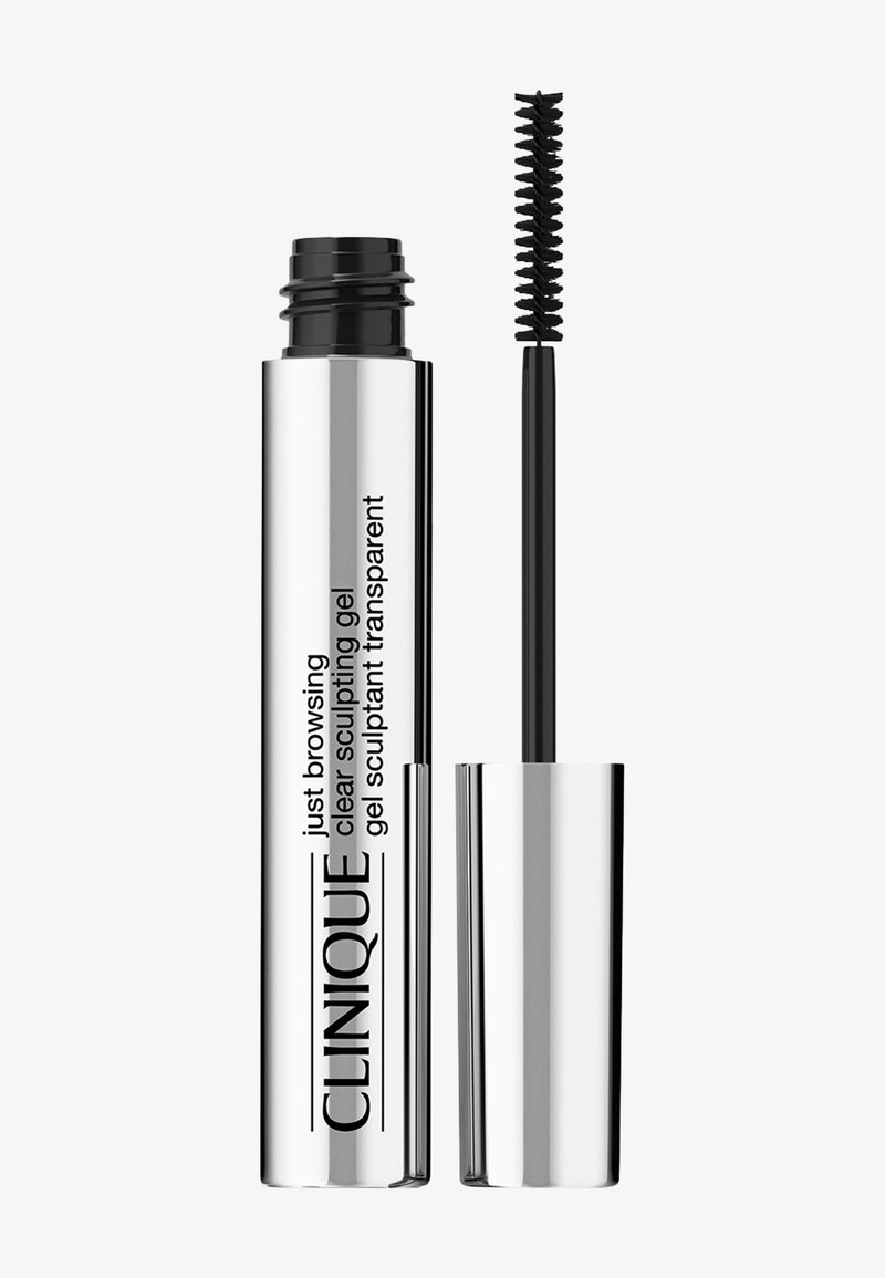 Gel da toelettatura trasparente in un elegante tubo metallico argento con testo nero. Include un pennello sottile per l'applicazione, progettato per uno styling preciso.