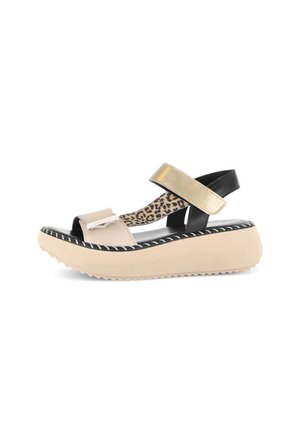 Beige and black platform sandals with a gold strap, featuring a leopard print insole and textured rubber sole, styled with white stitching details.