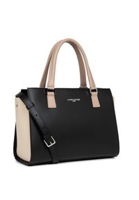 Sac à main en cuir noir et beige avec un design structuré, double poignées, bandoulière réglable et détail de logo sur le devant.