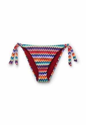 Bikinihose mit mehrfarbigem Zickzackmuster, Seitenschnüren und rotem Innenfutter auf weißem Hintergrund.