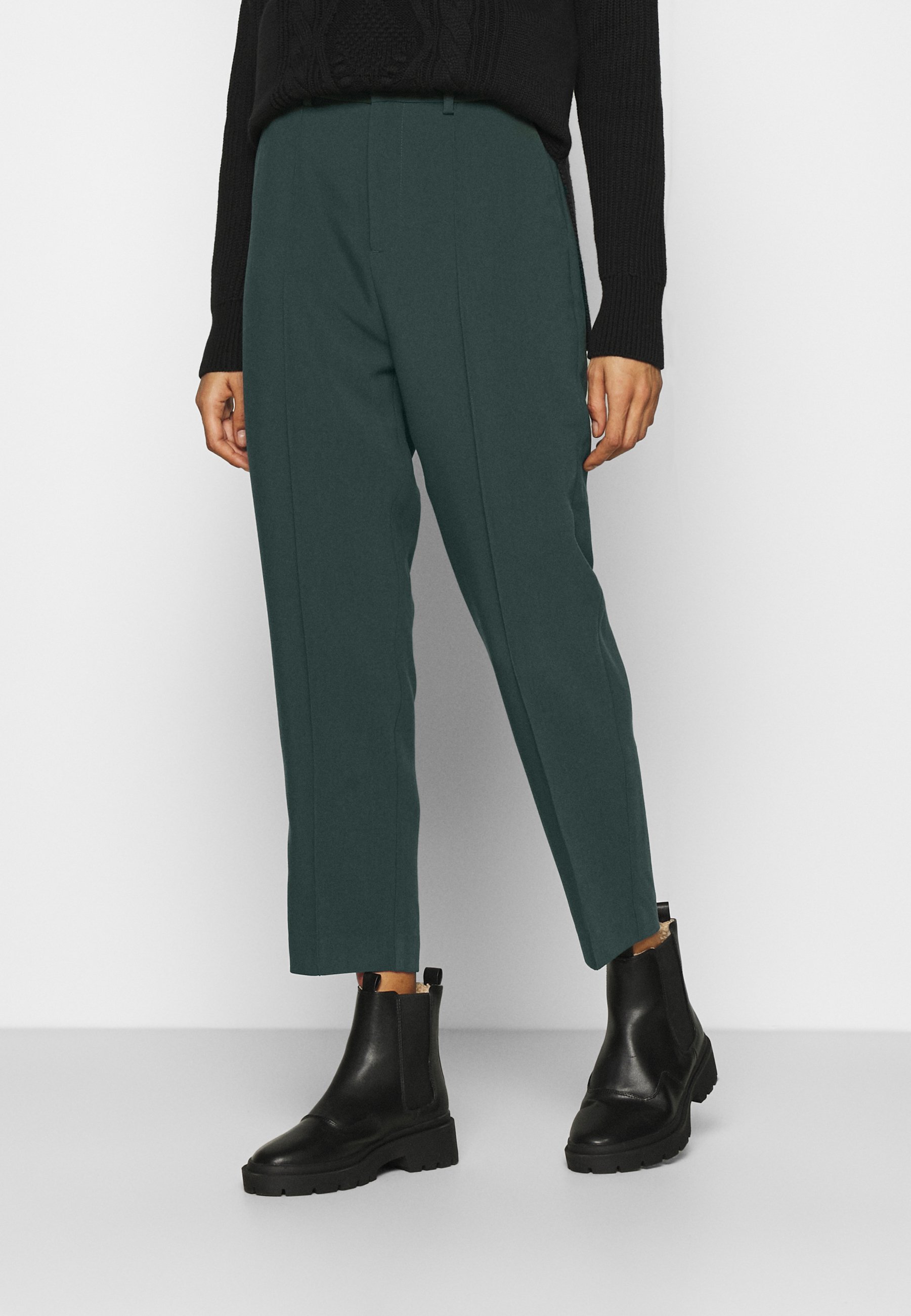 dark green trousers