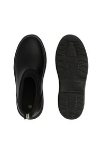 Zapatos slip-on negros con parte superior de caucho lisa, suela negra texturizada y franja blanca decorativa. Talla 38 marcada en el interior. Resistentes al aceite.