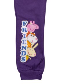 Lila Sweatpants mit einem grafischen Druck von Charakteren und dem Wort "FREUNDE" in fettem Blau. Weicher Stoff mit elastischem Bund.