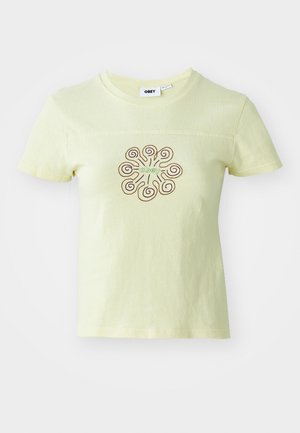 Light yellow cotton t-shirt featuring a brown and green swirl pattern with the word "obey" at the center. Short sleeves and crew neckline.