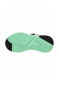 Suela de zapato con una base de goma verde que presenta un patrón ondulado, acentuada por goma negra alrededor del tacón y líneas de agarre texturizadas.