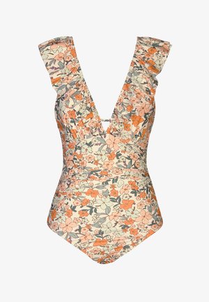 Costume intero floreale con fiori arancioni, pesca e verdi, scollo a V profondo e spalline arricciate su sfondo crema.