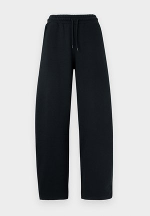 Schwarze Jogginghose aus weichem Stoff mit weitem Bein, elastischem Bund und Kordelzug. Mit seitlichen Taschen für mehr Funktionalität.
