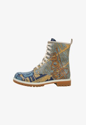 Graphic ankle boot featuring a blend of blue and tan fabric, bold text patterns, cream laces, and a rubber sole with a textured finish.