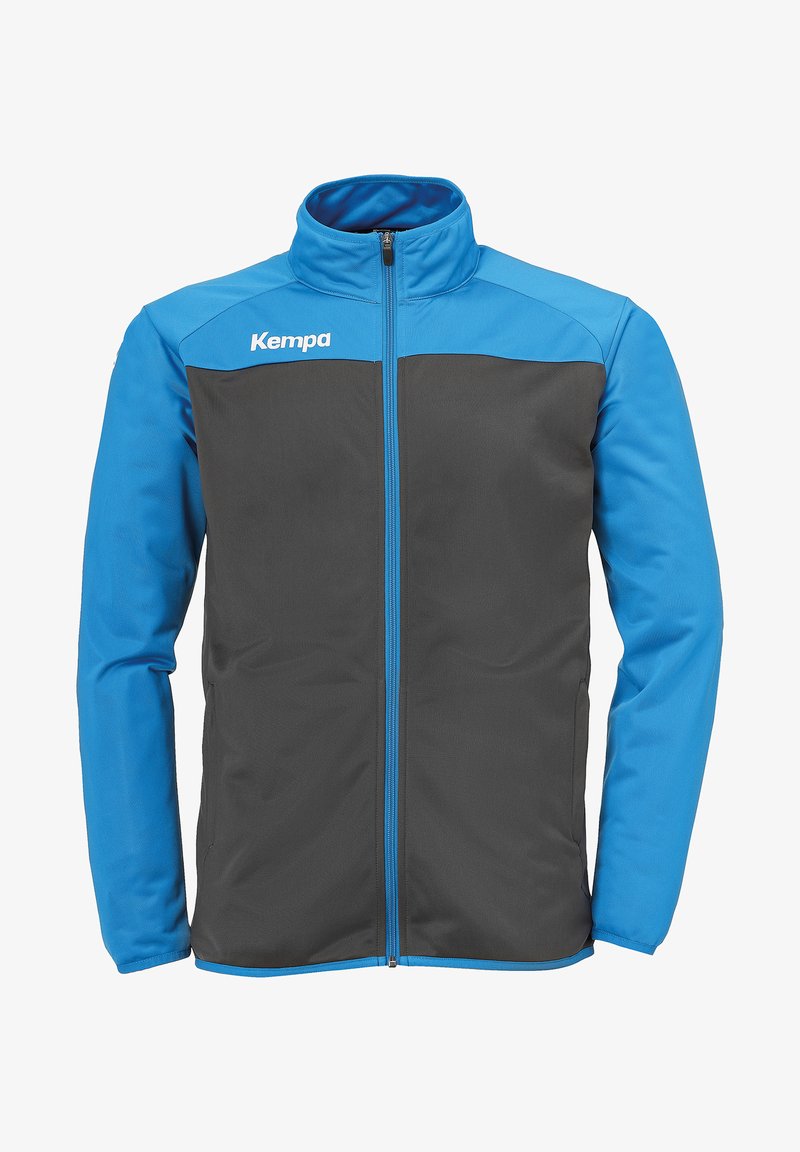 Blauwe en grijze sportjacket met een ritssluiting, voorzien van contrasterende panelen, een hoge kraag en het "Kempa"-logo op de borst.
