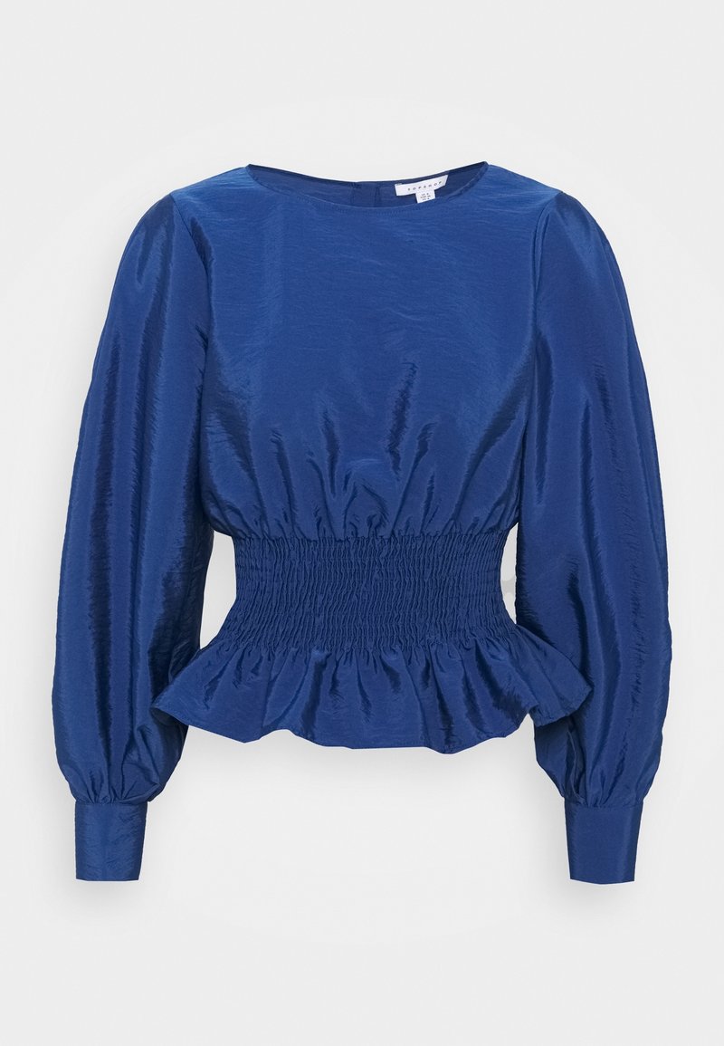 Top in satin blu con maniche lunghe a sbuffo, vita arricciata e orlo peplum. Presenta una scollatura rotonda e una superficie liscia.