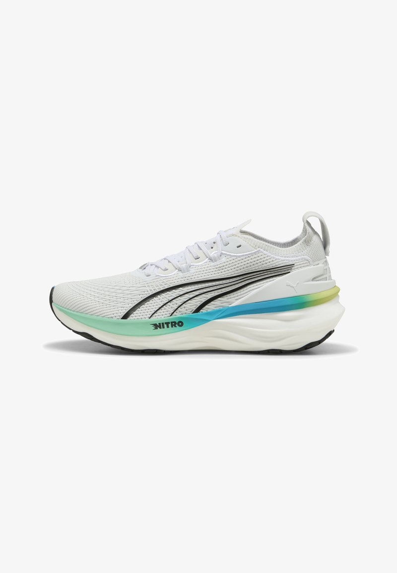White running shoe with a textured knit upper, black accents, and a multicolored sole featuring green and blue gradients.