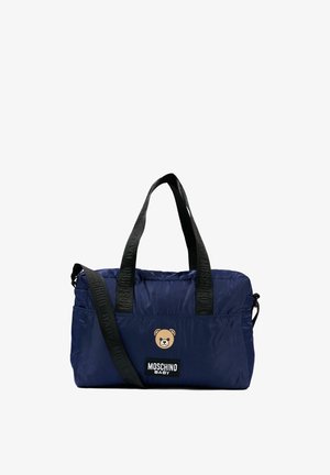 Granatowa torba typu tote Moschino Baby z czarnymi uchwytami i paskiem na ramię, z logo w kształcie twarzy misia na przedniej kieszeni.