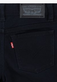 Levi's® WIDE LEG - Traperice krojene za nošenje s čizmama - black
