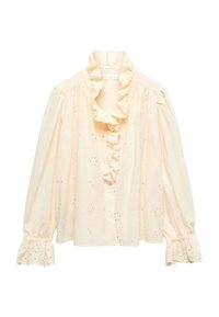 Blusa di un leggero color crema con colletto arruffato, caratterizzata da motivi floreali in broderie anglaise e maniche a sbuffo arricciate con polsini frill.