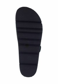 Black rubber shoe sole with a textured, ridged pattern. Oval shape with distinct grooves for traction and stability.