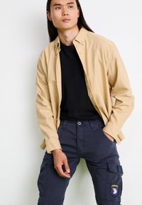 Alpha Industries PETROL PATCH - Cargo trousers - ultra navy
