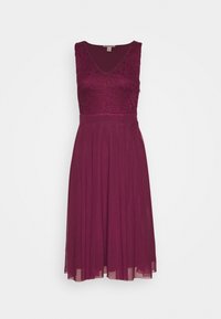 Burgundská šaty do délky kolen s přiléhavým krajkovým tělem, výstřihem do V a splývavou skládací sukní. Měkká, strukturovaná tkanina s hladkým povrchem.