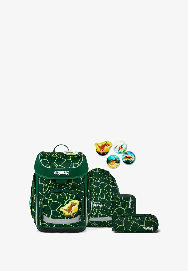 Set di zaini verdi con motivo a guscio di tartaruga, include una borsa grande, una pochette più piccola e un astuccio con illustrazioni di dinosauri.