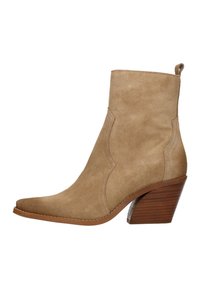 Beige suede ankle boot with a pointed toe, curved stitching details, and a stacked wooden heel. Features a small pull tab at the back.