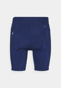 Navyblue-padded pyöräilyhousut nähtynä takaa, näkyvillä ompeleet ja pieni valkoinen logo sivulla.