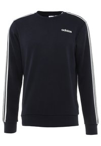 Sudadera de Adidas azul marino de manga larga, con puños de canalé y acentos blancos de tres rayas a lo largo de los hombros. Tejido de mezcla de algodón.