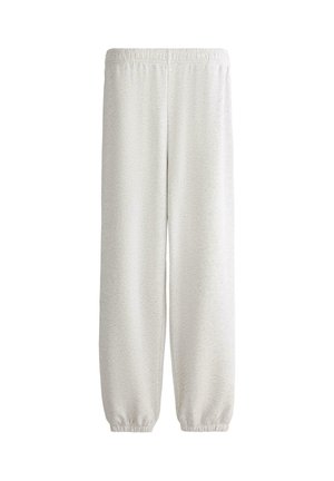 Pantalon de survêtement gris clair avec taille et poignets élastiques, coupe droite et ample, sans poches visibles ni logos, design simple.