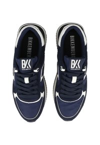 Navy blue athletic shoes with white accents, featuring a mesh and suede upper, round toe, and a logo on the tongue and insole.