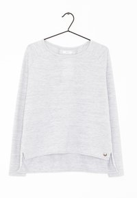 Ljusgrå långärmad tröja med rundad nederkant, raglanärmar, sidoflikar och en metallisk detalj vid fållen.